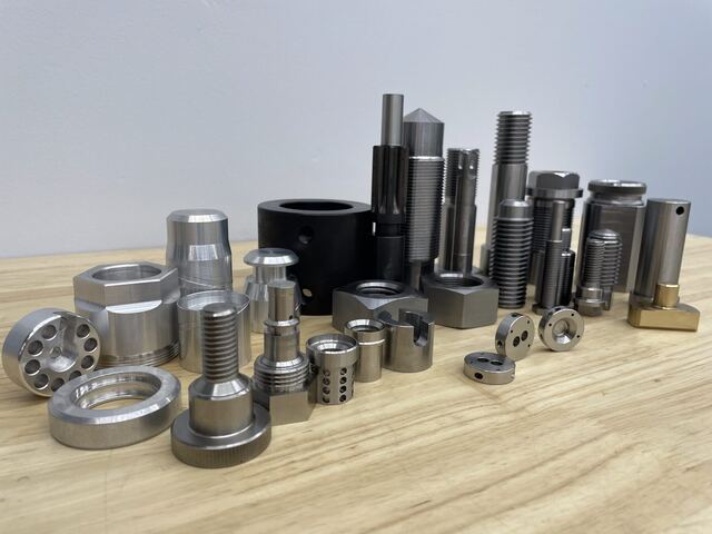 Threaded and ported machined components produced at RG Manufacturing in Rockford, Illinois